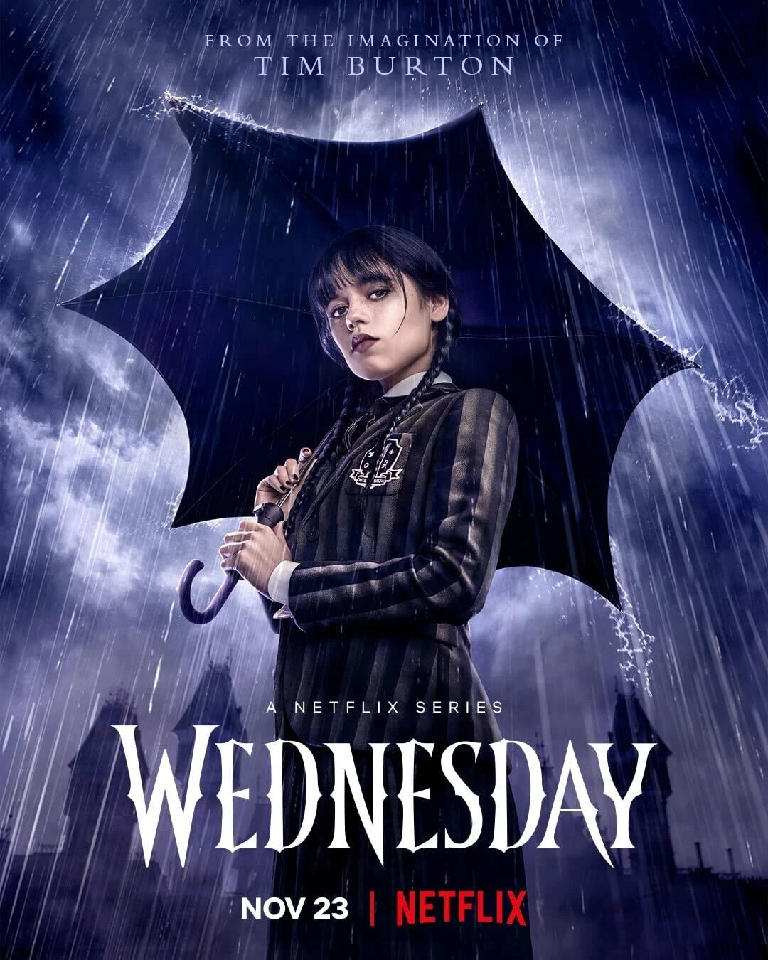 Promotional poster for the Netflix series "Wednesday," featuring a girl in black attire holding an umbrella under the rain. Text reads: "From the imagination of Tim Burton" and "Nov 23 | Netflix" at the bottom. Series title "Wednesday" is prominently displayed.