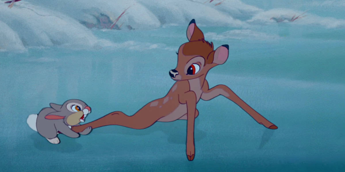 An animated young deer with large eyes and long legs, named Bambi, struggles to stay upright on an icy surface. A gray rabbit, named Thumper, is next to Bambi, holding one of his legs to help him balance. The background is a snowy, winter landscape.