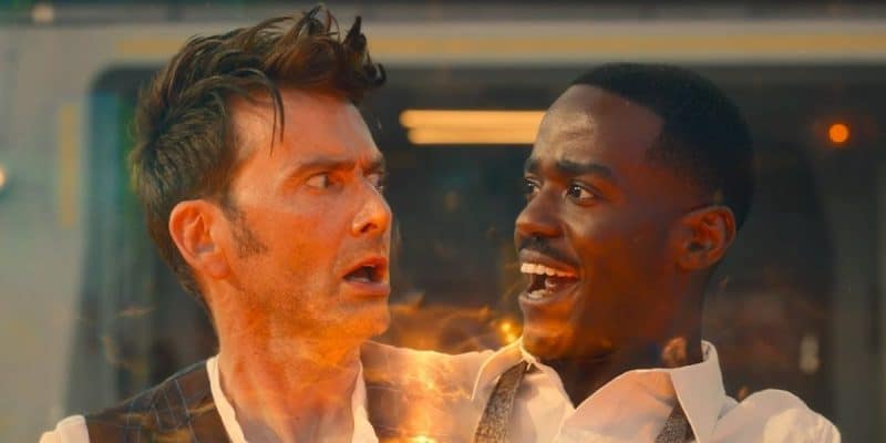 Two individuals appear to be undergoing a transformation. One looks shocked, with wide eyes and messy hair, while the other has a joyful expression. Both men are illuminated by a warm, glowing light coming from their bodies.