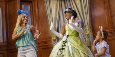 A family meeting Princess Tiana at Magic Kingdom's Princess Fairytale Hall