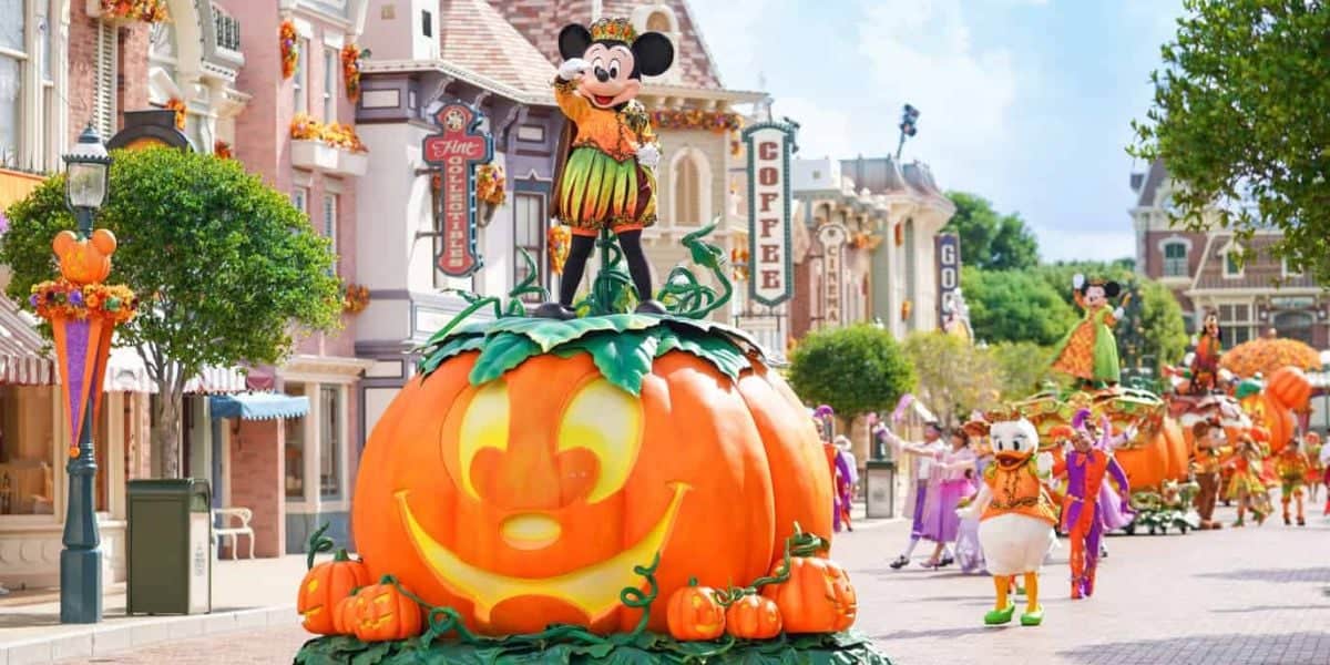 Mickey Mouse stands on top of a pumpkin in a Halloween parade at Hong Kong Disneyland