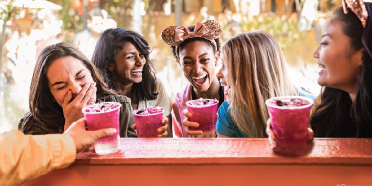 Women drink at Disney California Adventure Food and Wine