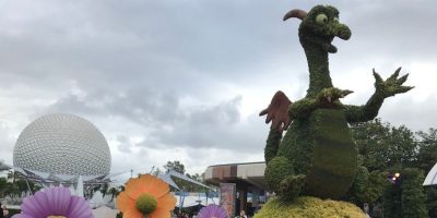 A Topiary at EPCOT shaped like Figment. It sits in front of Spaceship Earth.
