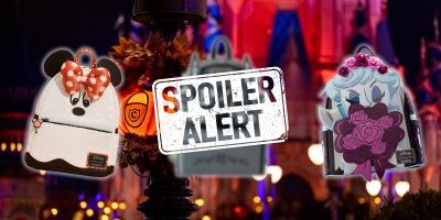 The image features two exclusive Disney Loungefly bags on either side of a "Spoiler Alert" sign in front of a blurred background of a Halloween-themed castle. One backpack has Minnie Mouse ears and bow, while the other features a floral design with a character's face.