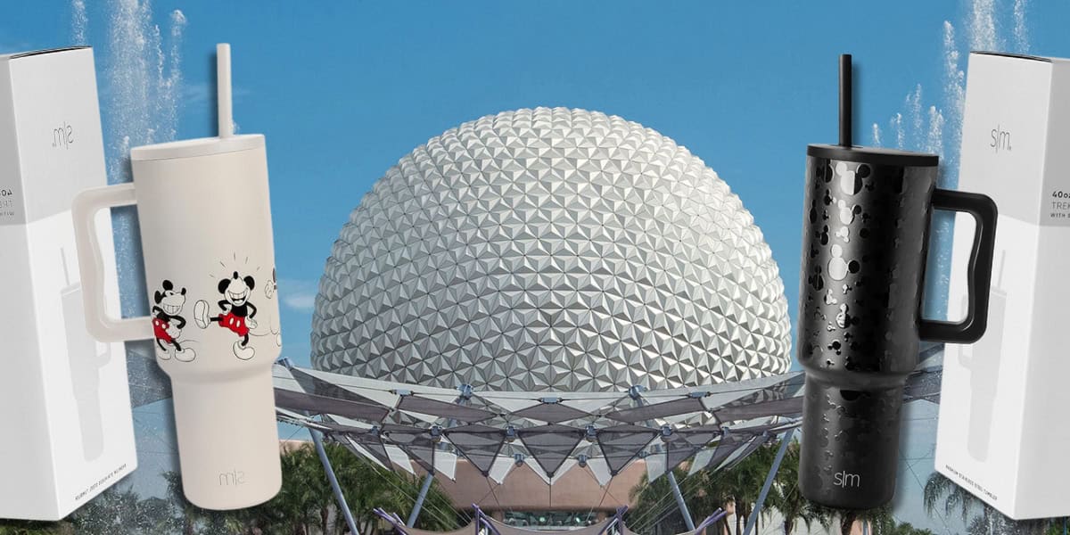 A white Disney Stainless Steel Tumbler featuring classic cartoon characters stands on the left and a black travel tumbler with a subtle pattern stands on the right; in the background is the iconic geodesic sphere of Epcot, surrounded by clear blue skies and palm trees. A stylish choice for any adventure.