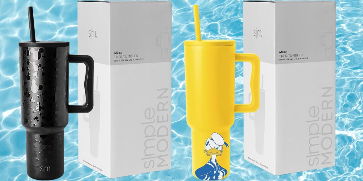 Two travel tumblers with handles and straws are shown in front of their boxes on a background resembling a pool. The black tumbler has the Simple Modern logo, while the yellow Disney Stainless Steel Tumbler features a cartoon duck character wearing a sailor hat. Perfect for fans!
