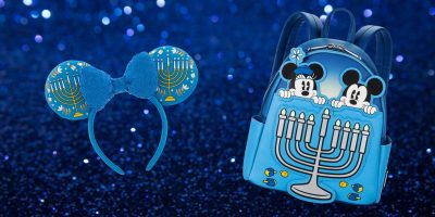 The Hanukkah Collection features a blue headband with Mickey Mouse ears and a menorah design on the left, and on the right, a Disney Store exclusive backpack with Mickey and Minnie peeking over a menorah. The glittery blue background adds an extra touch of magic.