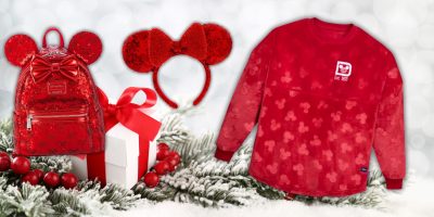 A festive scene with a red sequined backpack reminiscent of Loungefly bags featuring mouse ears, a matching red headband, and a shirt adorned with subtle mouse motifs. They're set on a snowy surface next to a white gift box wrapped in a red ribbon.