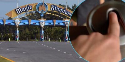 The entrance archway of Magic Kingdom welcomes you next to an image of a guest scanning his fingerprint to enter the Walt Disney World Resort theme park.
