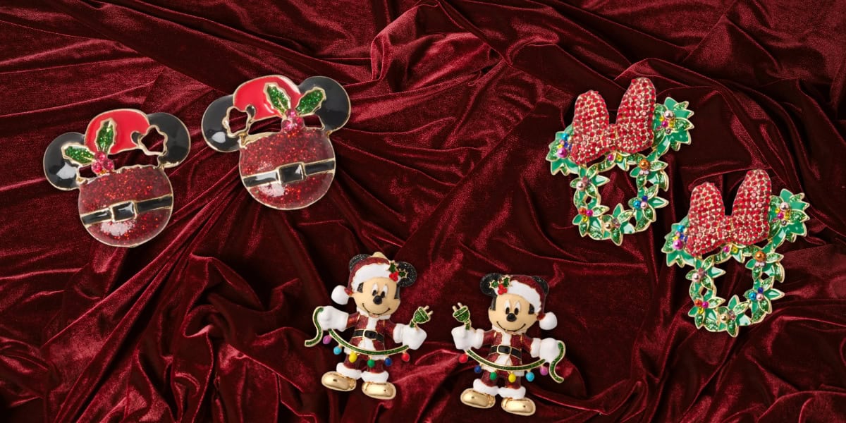 Discover a magical assortment of Christmas-themed earrings featuring beloved cartoon characters in Santa hats and festive wreaths. Displayed on luxurious red velvet fabric, these BaubleBar Earrings are exclusively available at the Online Disney Store.