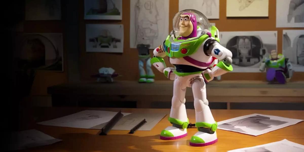 A Buzz Lightyear toy stands on a desk surrounded by sketches, as if contemplating strategies for an automated drafting system. The dimly lit room is filled with artwork, and the lighting emphasizes the toy's vibrant colors, reminiscent of drafting plans in an artist's creative domain.