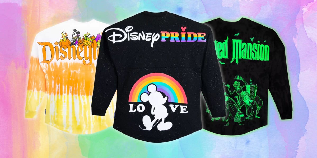 Discover the magic at the Disney Store with these vibrant Spirit Jerseys. Featuring three colorful long-sleeve shirts: an orange one adorned with beloved Disney characters, a black Pride edition with Mickey Mouse and a rainbow, and another black shirt boasting Haunted Mansion graphics. Enjoy magical savings!