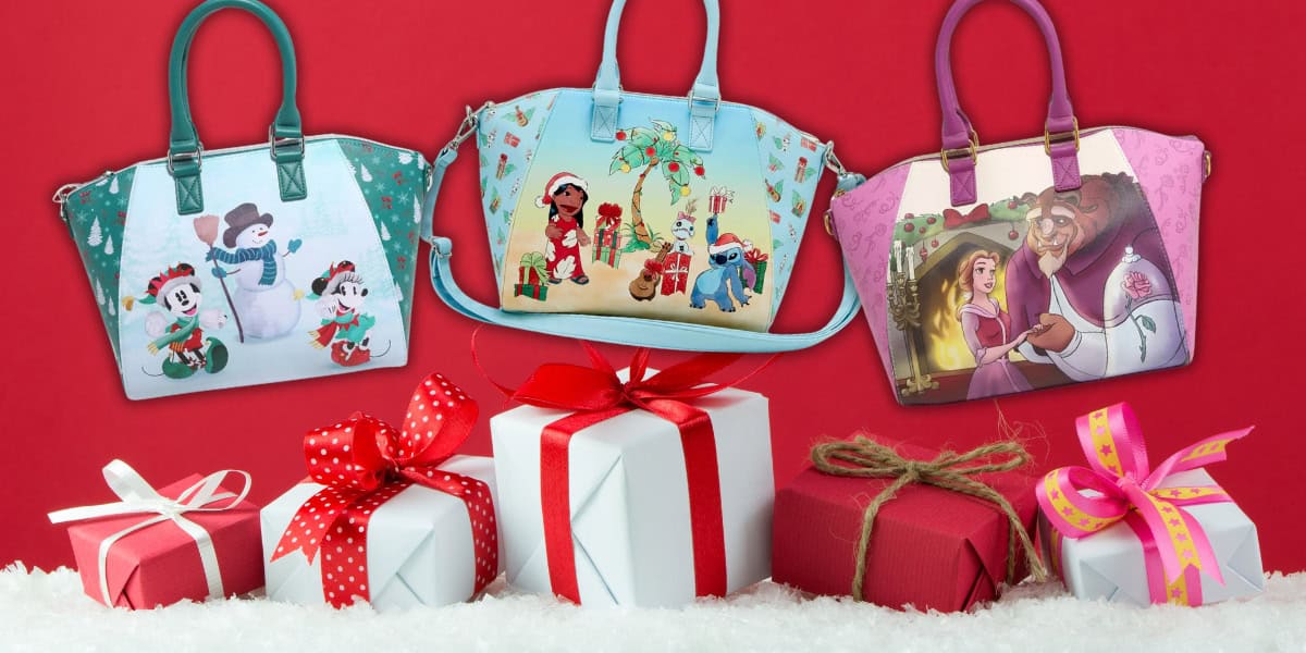 Three Disney Loungefly Bags with colorful cartoon designs are displayed against a red background. In front of them, variously wrapped gift boxes sit on a layer of snow, creating a festive scene to celebrate the season.
