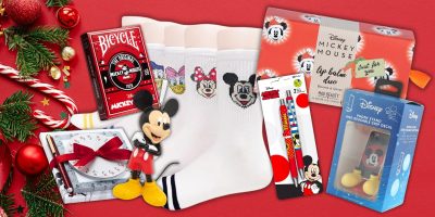 Discover the magic of Mickey Mouse with this delightful collection perfect for adult fans. From socks and playing cards to lip balm and an iPhone case, these affordable stocking stuffers, set against a festive red backdrop with a pine branch and ribbon, make any occasion special.