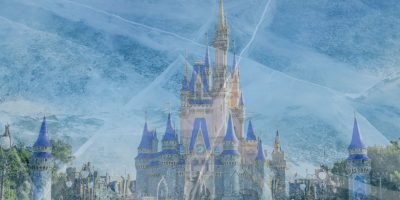 The Cinderella castle with tall spires, surrounded by trees. The image is overlaid with an icy, frosty texture, giving it a wintry appearance at Magic Kingdom inside Walt Disney World Resort.