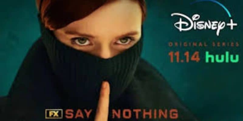 A person with red hair covers their mouth with a black turtleneck, while holding a finger to their lips. The image promotes a Disney+ original series, premiering on 11.14, also available on Hulu, with the caption "FX Say Nothing.