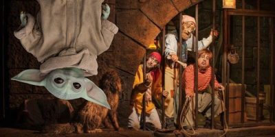 Baby Yoda floating over the jail scene in the Pirates of the Caribbean attraction.