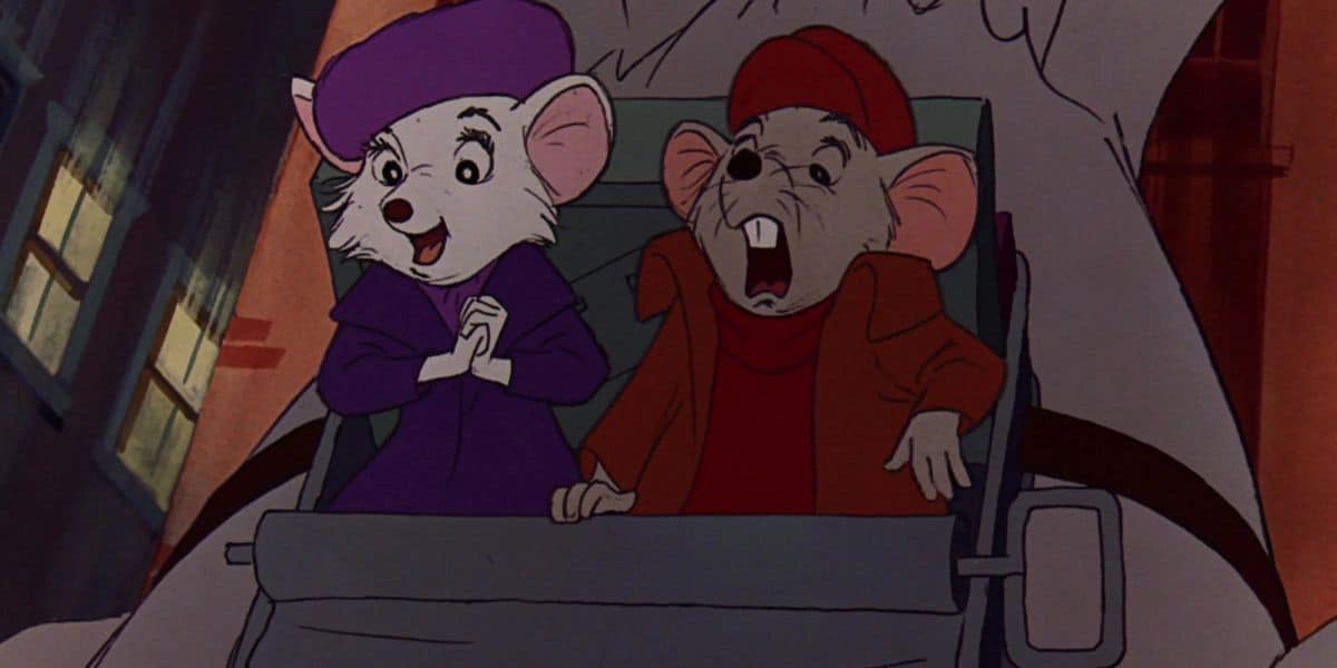 Two animated mice clad in warm clothes sit in a vehicle at night, reminiscent of a Disney Movie. The mouse on the left sports a purple hat and coat, while the one on the right dons red. They gaze ahead with surprise and excitement, capturing that timeless Childhood Classic charm.