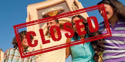 A family of four in front of the entrance to Universal Studios Florida with the word "Closed" overlay