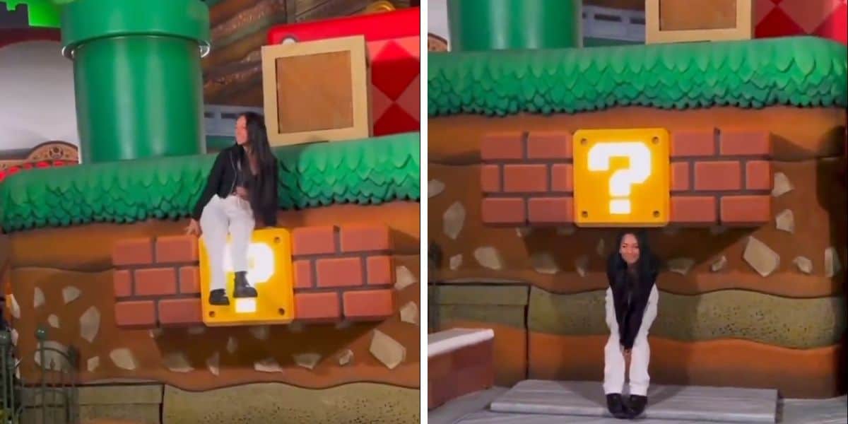 A woman visits Universal Studios Hollywood and climbs on a display