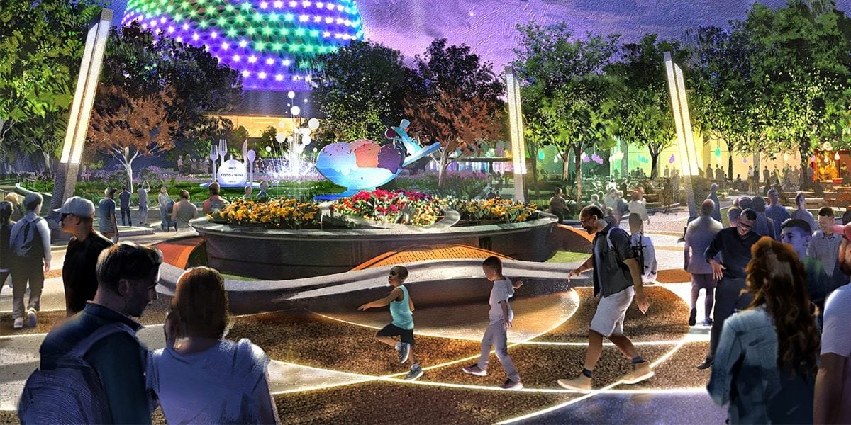 People stroll through a vibrant, futuristic park at night, illuminated by colorful EPCOT World Celebration lights. A glowing geodesic dome stands in the background as beams of light dance in the sky. With trees and a water fountain, the lively atmosphere enchants all who visit at Disney World.