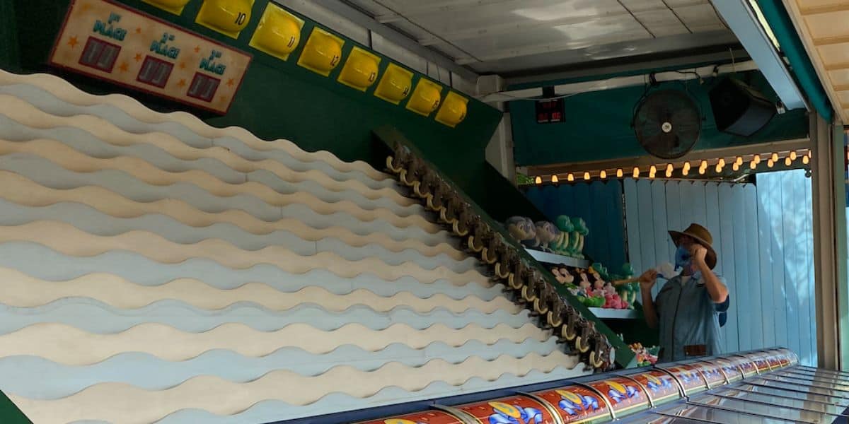 One of the games in DinoLand U.S.A., with prizes including Mickey and Minnie Mouse on display.