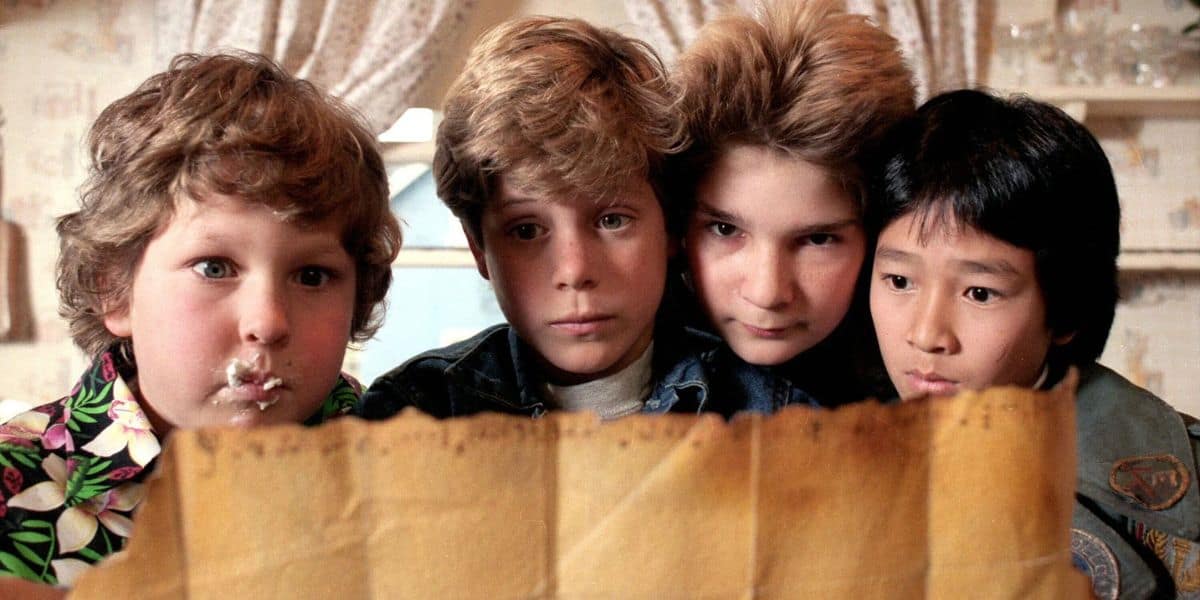 Jeff Cohen as Chunk, Sean Astin as Mikey, Corey Feldman as Mouth, and Ke Huy Quan as Data in The Goonies
