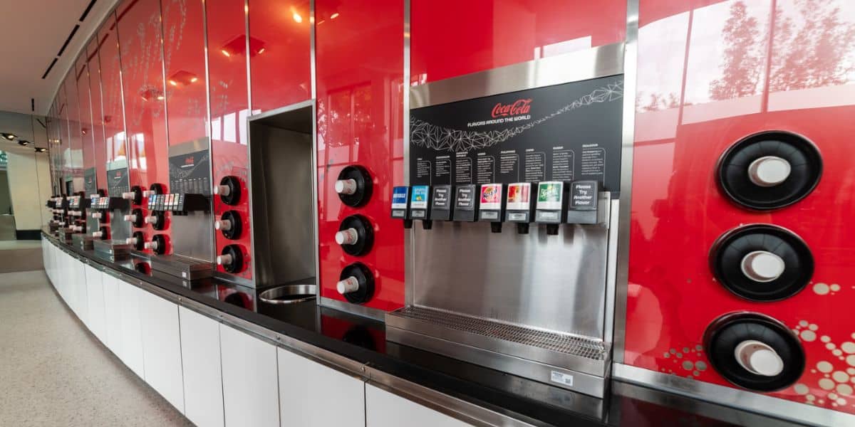 A row of Coca-Cola machines with international beverages at Club Cool in EPCOT.