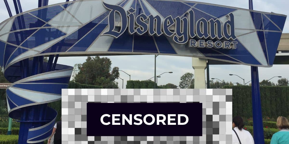 The entrance to Disneyland Resort showcases a large decorative blue and white sign proudly emblazoned with "Disneyland Resort." The area underneath is censored with a blur bar.