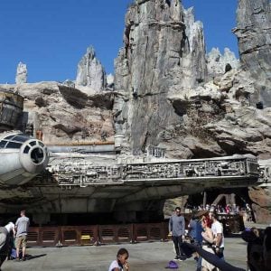 Visitors stroll around the Millennium Falcon at Galaxy's Edge