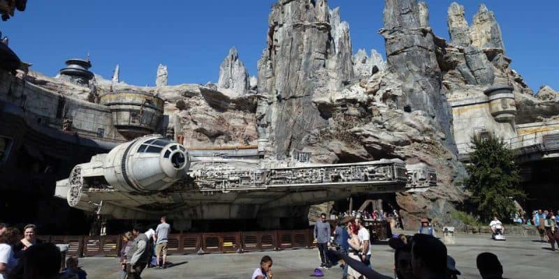 Visitors stroll around the Millennium Falcon at Galaxy's Edge