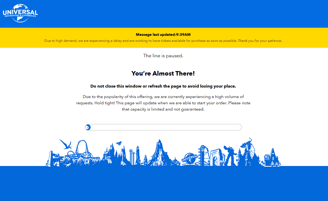 A virtual queue page for Universal Studios, displaying a paused message. It advises users not to refresh the page due to high demand, and includes blue graphics of various attractions at the bottom. This is likely due to Universal revealing Epic Universe Express Passes. 