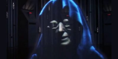 A holographic figure reminiscent of a Star Wars character, wearing a dark hooded robe, stands against vertical structures. The face, partially shadowed, channels Clive Revill's enigmatic aura, adding layers to the mysterious atmosphere.