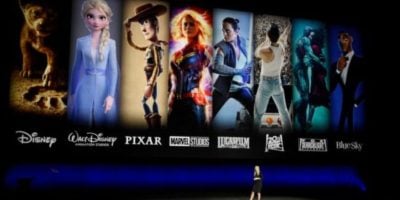 A woman giving a presentation about Disney Plus with Star Wars, Marvel and more.