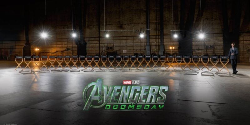Robert Downey Jr. stands next to a long row of director's chairs with names from the cast of the upcoming Avengers Doomsday