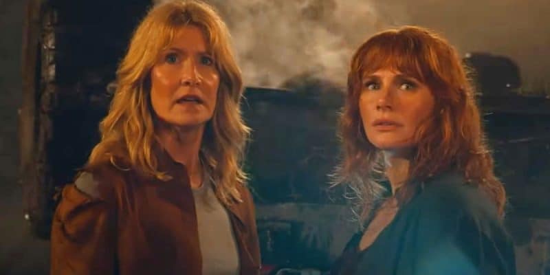 L to R: Laura Dern as Ellie Sattler and Bryce Dallas Howard as Claire Dearing facing the Giganotosaurus in 'Jurassic World Dominion'