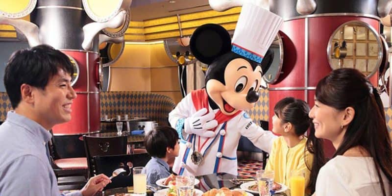 Mickey Mouse meets guest at Chef Mickey, a Disney dining experience.