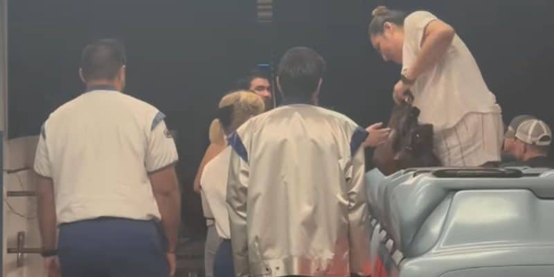 Disney cast members evacuating guests from Space Mountain after a derailment.