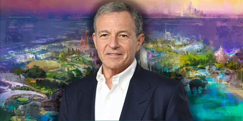 Disney CEO Bob Iger stands in front of a colorful, abstract background that resembles a futuristic city or theme park of Disneyland Abu Dhabi in the Middle East.