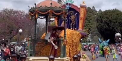 A Disney parade float, featuring Miguel from 'Coco', stopped temporarily.