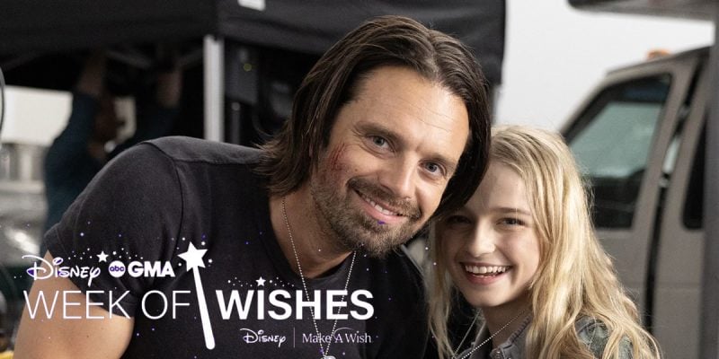 Sebastian Stan smiles beside a young blonde girl at a Disney Make-A-Wish wish-granting event.