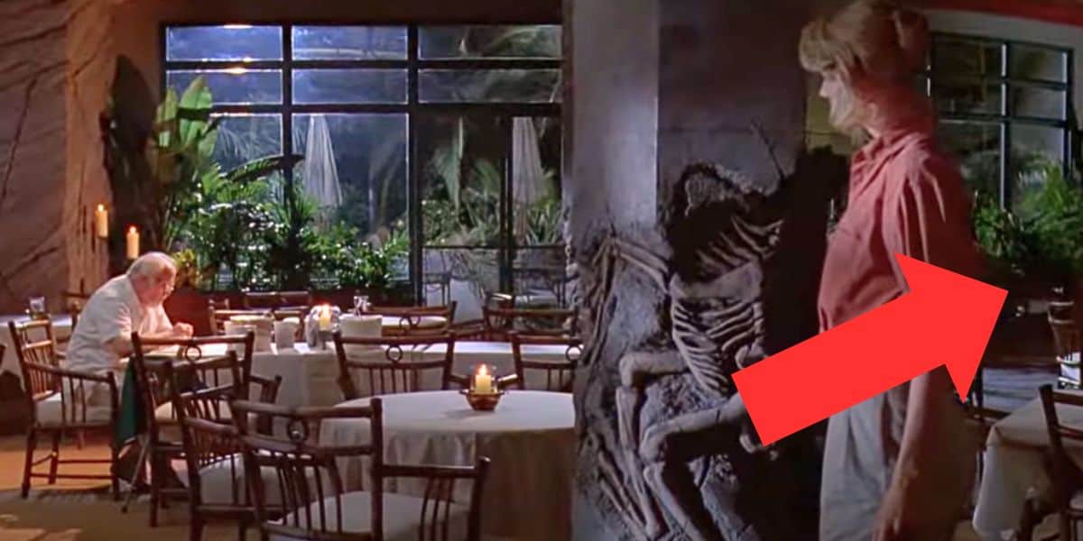 A scene from 'Jurassic Park' (1993) where Ellie approaches Hammond at the table