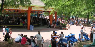 Crowds in front of a carousel at Carowinds.