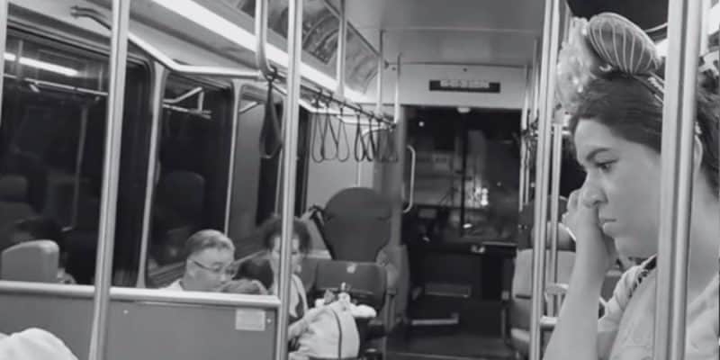 A black and white photo of people in a Disney World bus after a minor accident.