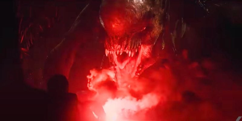 The D-Rex roaring in red light in 'Jurassic World Rebirth'