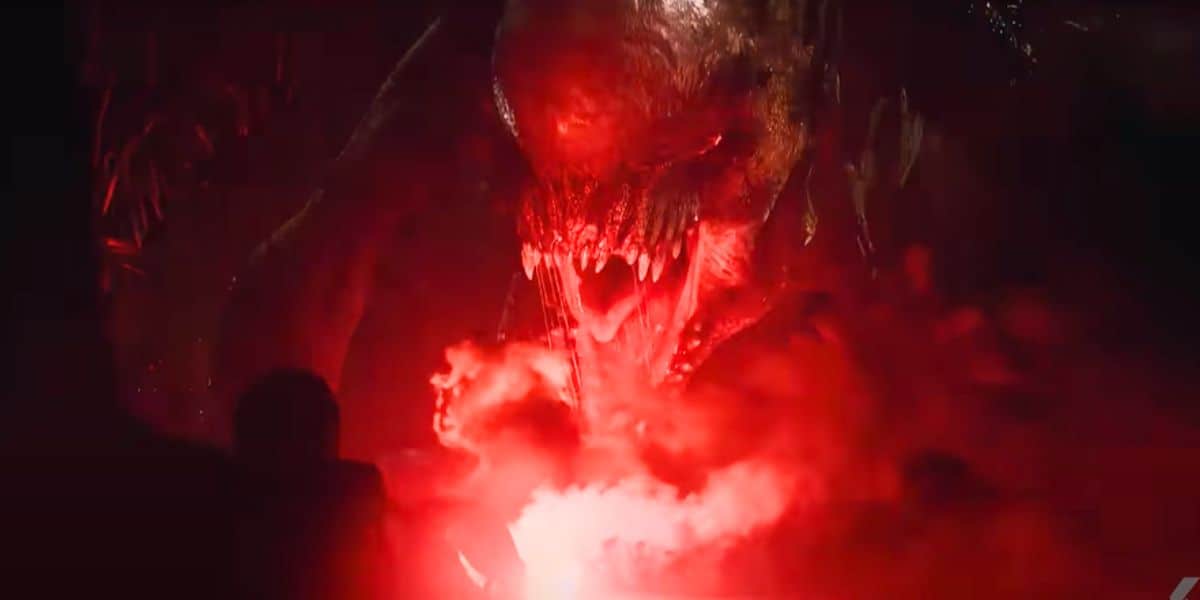 The D-Rex roaring in red light in 'Jurassic World Rebirth'