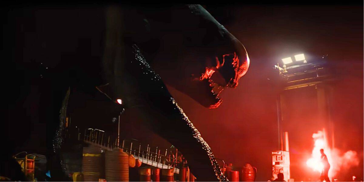 The D-Rex roaring in red light in 'Jurassic World Rebirth'