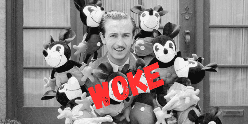 black and white picture of young walt disney with mickey stuffed toys and woke written across the picture