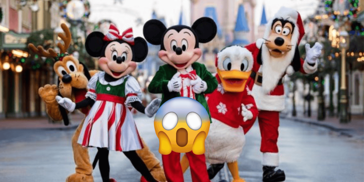 Mickey Mouse, Minnie Mouse, Pluto, Donald Duck, and Goofy wear festive holiday outfits and pose happily together at Disney World for the 2025 holiday season. A shocked face emoji covers part of their bodies.