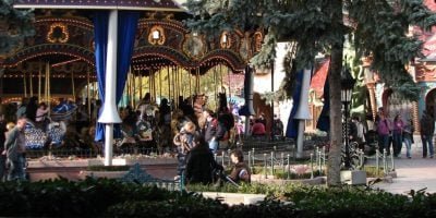 People near the carousel in Fantasyland at Disneyland Paris.
